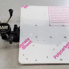 tray and ram phone holder mounted on either side