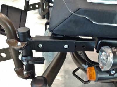 Use existing bolt holes in frame to attach mount; replace with longer bolts if necessary.