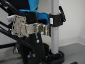 Attach pair of L-Angle Extension plates to offset for tray width. Attach the Wheelchair Bracket