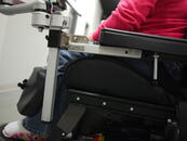 This mount is attached to a Post Extension Kit, in order to move it further forward, in front of the armrest.