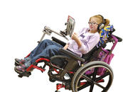 She needs to tilt her wheelchair throughout the day, but she can still access her ipad!