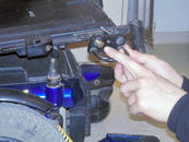 Remove the Quantum wheelchair tie-downs and replace the short bolt with the one supplied. 
