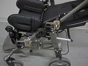 Two Wheelchair Brackets are attached-one with collar clamps and one with bridge clamps