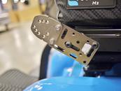 Attach an Angle Adjustment Plate to the threaded holes on the end of the AP4. You can flip the AAP either side to figure out the best two holes to align and attach the Solid Wheelchair bracket. You want the post to be as vertical as possible.