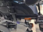 This chair does not have a track. There are two welded nuts just behind and to the inside of the footrests. They are used to adjust the footrest width, and can be used to attach an Adapter Plate.