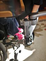 An L-Angle Extension is shown attached to offset/reposition the Wheelchair Bracket.