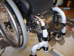 A tight squeeze: an AP4 plate attaches to the Oval bridge clamps. Wheelchair Bracket is placed forward to allow brake use.