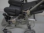 Two Wheelchair Brackets are attached-one with collar clamps and one with bridge clamps
