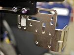 This example shows the L-Angle Extension Plate attached lower, to offset the Solid Wheelchair Bracket so the mount can be positioned lower.