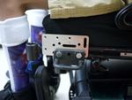 Adapter Plate "sandwiched" between tie-down and wheelchair; attach the Wheelchair Bracket to the Adapter Plate.